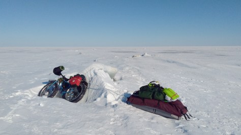 Bradley D. Paul's Ice Cream Truck and pulk crossing the ice and at a fissure.